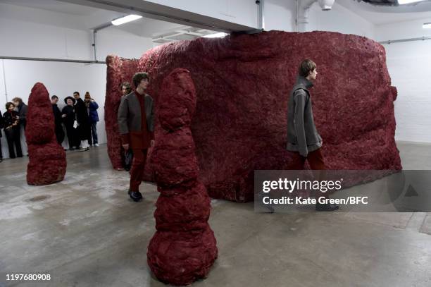 Models walk the runway at the Omar Afridi Presentation during London Fashion Week Men's January 2020 at the Dray Walk Gallery on January 05, 2020 in...