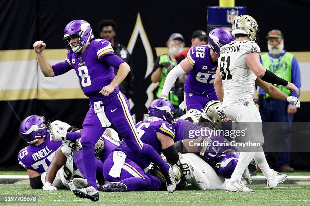 Kirk Cousins of the Minnesota Vikings celebrates after a third quarter rushing touchdown by Dalvin Cook against the New Orleans Saints in the NFC...