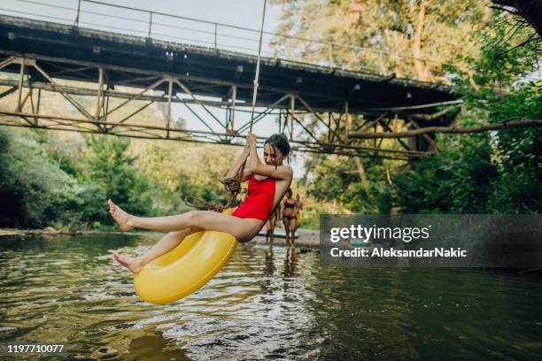 swing above the river - river tubing stock pictures, royalty-free photos & images