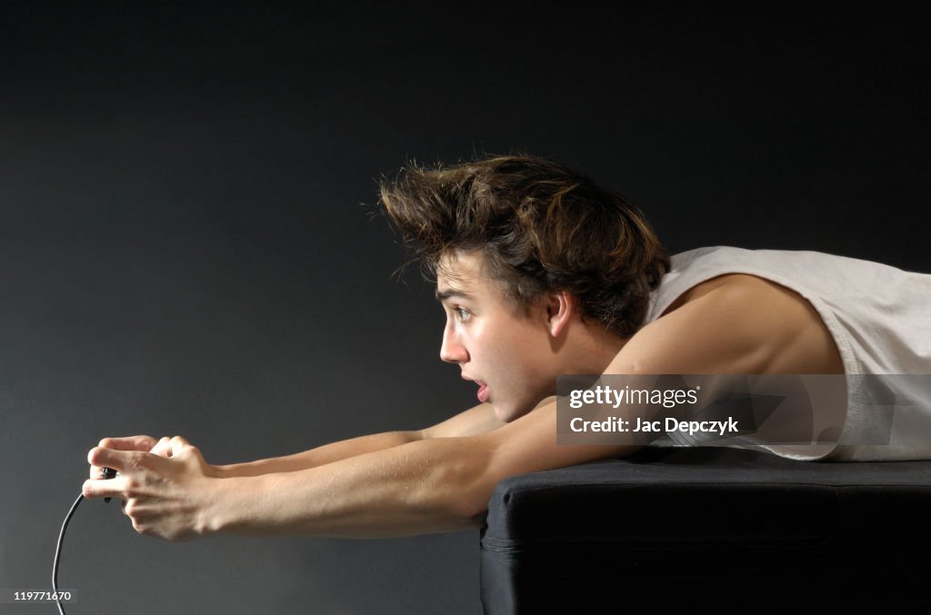 Young boy absorbed in computer game.