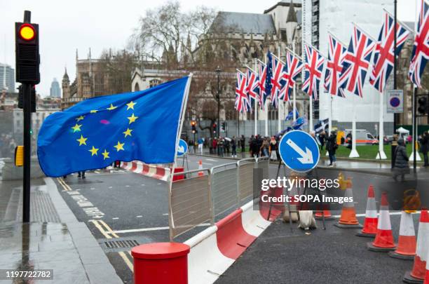 And the Jack union flags waving in Parliament Square during the demonstration. Remain supporters gathered at the entrance to the house of Parliament...