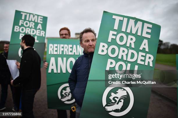 Anti Brexit protestors carry signs outside Stormont calling for a border poll on January 31, 2020 in Belfast, United Kingdom. The United Kingdom will...