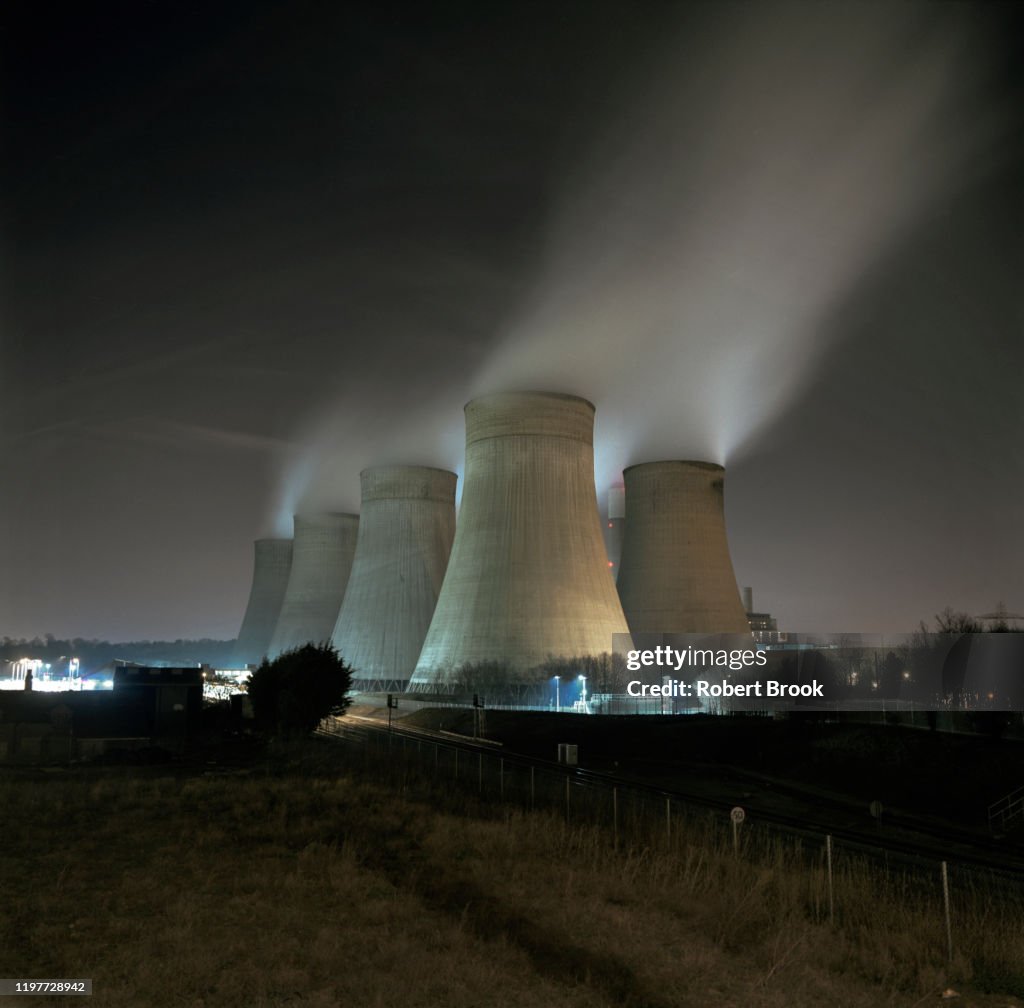 Fossil fuel power station at night