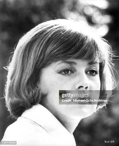 Jeanne Moreau with somber look in a scene from the film 'The Bride Wore Black', 1968.