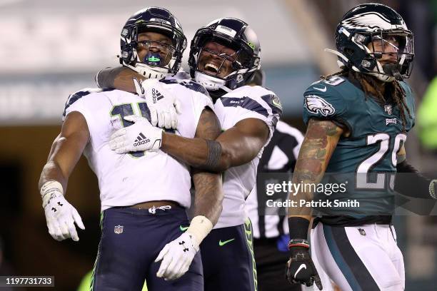 Metcalf of the Seattle Seahawks is congratulated by David Moore after making a reception for a touchdown against the Philadelphia Eagles in the third...