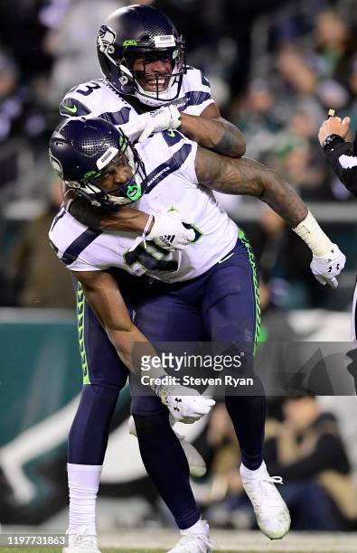 David Moore and D.K. Metcalf of the Seattle Seahawks celebrates Metcalf touchdown in the third quarter of the NFC Wild Card Playoff game against the...