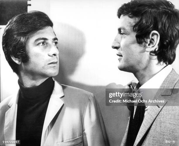 Jean Claude Brialy discusses marriage with his friend Claude Rich in a scene from the film 'The Bride Wore Black', 1968.