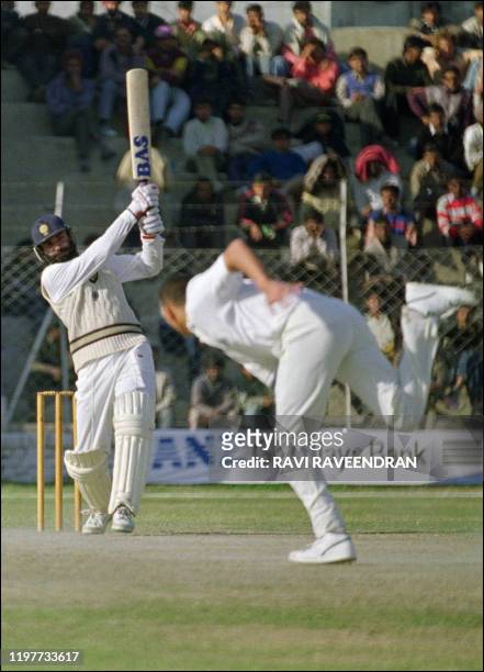 Indian opener Navjot Singh Sidhu strikes during his match-winning innings of 130 not out against England at New Delhi 13 January 1993. The tourists...