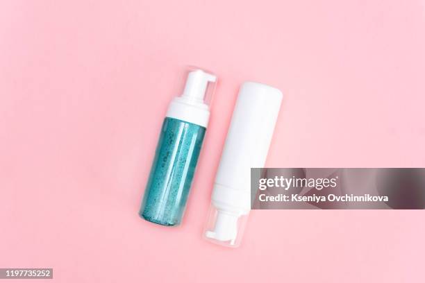 pink wash gel bottle on pink background - pump - dress shoe stock-fotos und bilder