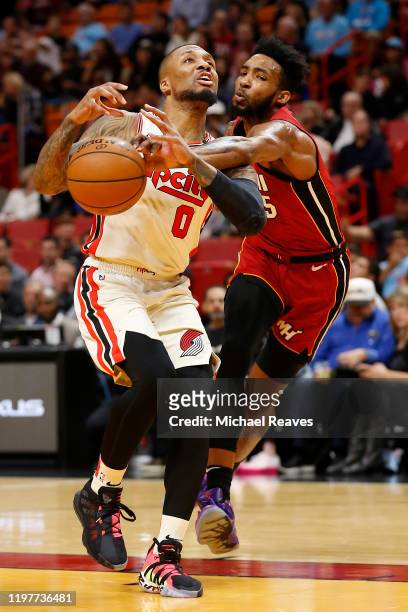 Damian Lillard of the Portland Trail Blazers drives to the basket against Derrick Jones Jr. #5 of the Miami Heat during the first half at American...