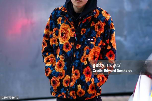 Guest wears a blue and orange floral print Napa fluffy coat, during London Fashion Week Men's January 2020 on January 05, 2020 in London, England.
