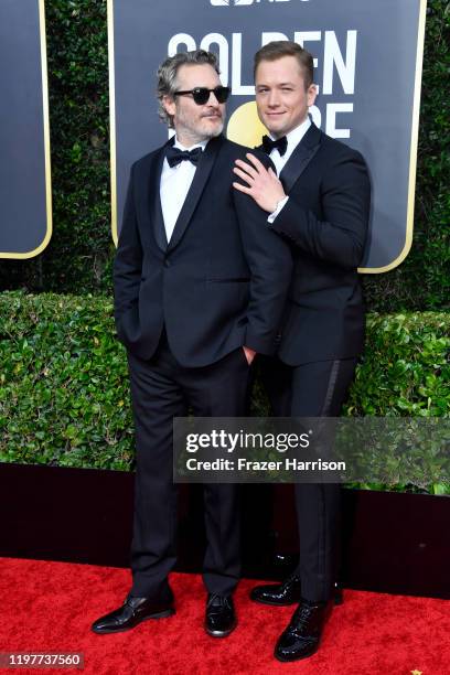 Joaquin Phoenix and Taron Egerton attend the 77th Annual Golden Globe Awards at The Beverly Hilton Hotel on January 05, 2020 in Beverly Hills,...