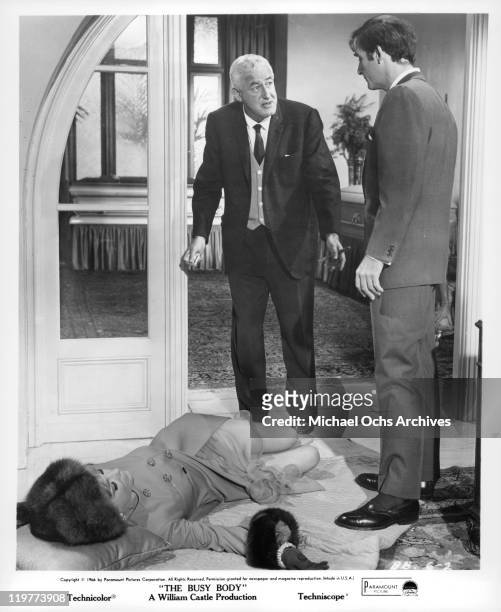 Director William Castle rehearses Anne Baxter and Sid Caesar for a scene from the film 'The Busy Body', 1966.
