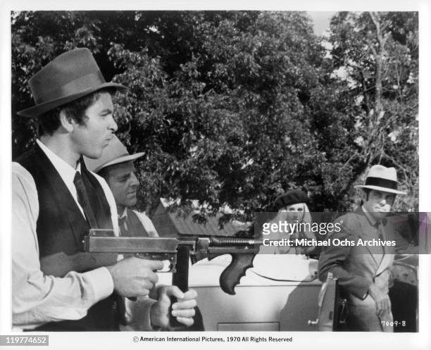 Fabian Forte is introduced to seasoned bank robber Michael Haynes , who teaches him how to operate a machine gun in a scene from the film 'A Bullet...