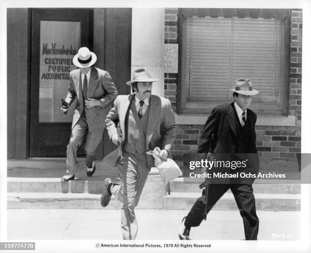 Fabian Forte, Adam Rourke, and Michael Haynes run from bank in a scene from the film 'A Bullet For Pretty Boy', 1970.