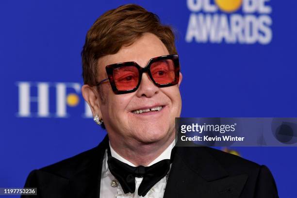 Elton John poses in the press room with the award for Best Original Song - Motion Picture during the 77th Annual Golden Globe Awards at The Beverly...