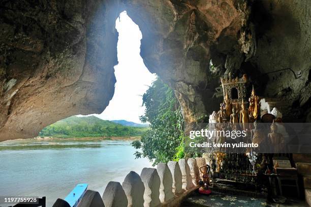 pak ou caves in luang prabang, laos - pak ou caves stock pictures, royalty-free photos & images