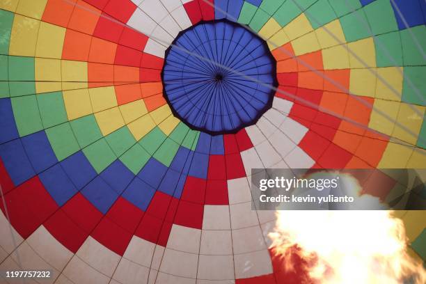 hot air balloon initiation - vang vieng balloon stock pictures, royalty-free photos & images