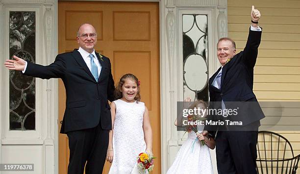 John Feinblatt and Jonathan Mintz celebrate after marrying with their daughters Maeve and Georgia at Gracie Mansion on July 24, 2011 in New York...