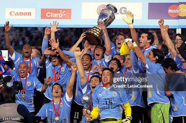 Uruguay National team players celebrate with the trophy their victory of the Copa America 2011 against Paraguay at Antonio Vespucio Liberti Stadium...