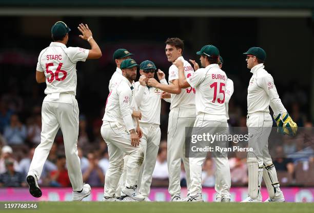 Pat Cummins of Australia celebrates after taking the wicket of Ross Taylor of New Zealand during day four of the Third Test Match in the series...