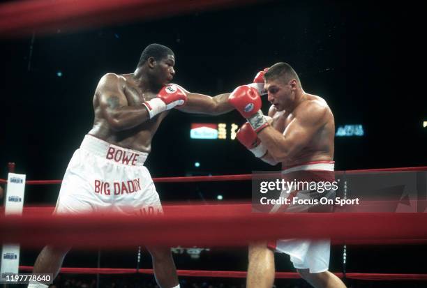 Riddick Bowe and Andrew Golota fights in a heavy weight match on July 11, 1996 at Madison Square Garden in the Manhattan borough of New York City.