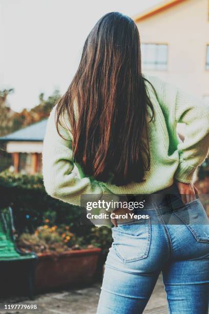 rear view young teen in blue jeans. - female backside fotografías e imágenes de stock