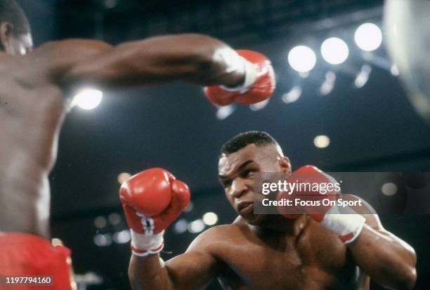 Mike Tyson and Frank Bruno fights for WBC Heavyweight title on March 16, 1996 at the MGM Grand Garden Arena in Las Vegas, Nevada. Tyson won the fight...