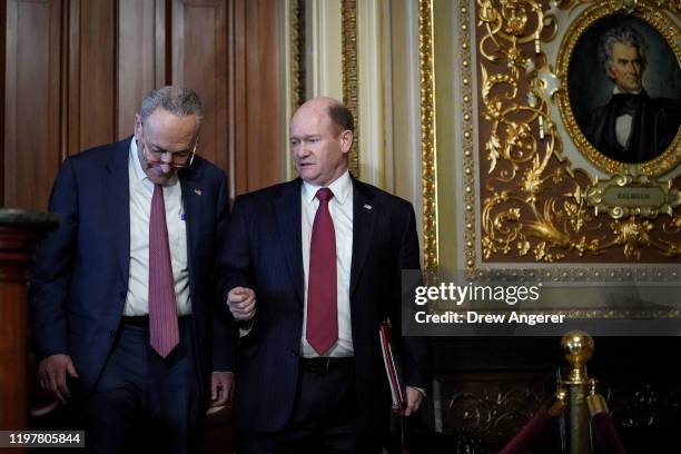 Senate Minority Leader Chuck Schumer and Sen. Chris Coons leave a closed door meeting with Senate Democrats as they walk to the Senate chamber for...