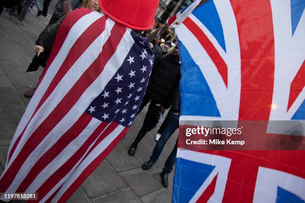Pro Brexit Leave supporter with both US and UK flags in Westminster on Brexit Day as the UK prepares to leave the European Union on 31st January 2020...