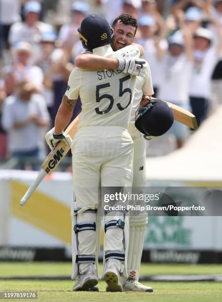 Dom Sibley of England celebrates with team-mate Ben Stokes after reaching his century during Day Four of the Second Test between England and South...
