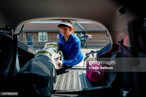 packing golf clubs away - car trunk stock pictures, royalty-free photos & images