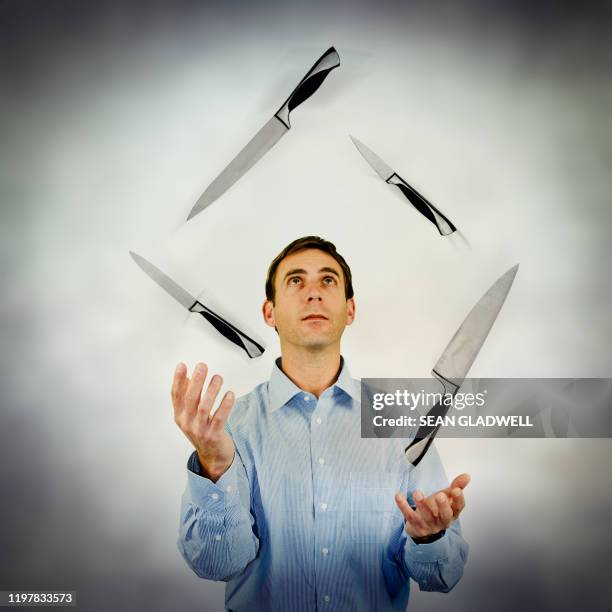 knife juggling - caught in the act stockfoto's en -beelden