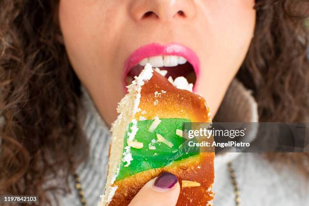 eating sweets - cream bun - rosca de reyes stockfoto's en -beelden