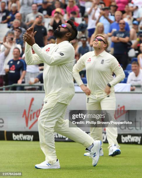 Comedian Romesh Ranganathan about to drop a catch as he and Rob Beckett were on the field at lunchtime trying to catch balls hit by Nasser Hussain...