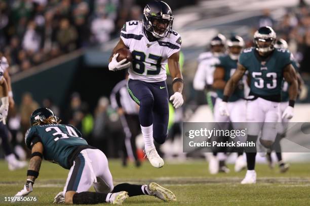 Wide receiver David Moore of the Seattle Seahawks rushes past cornerback Cre'von LeBlanc of the Philadelphia Eagles during their NFC Wild Card...