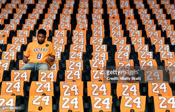 Usher sits alone in the stands at the Staples Center before his performance tonight to honor Lakers great Kobe Bryant on January 31, 2020 in Los...