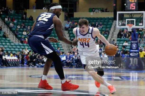 David Krämer of the Northern Arizona Suns drives against Chad Brown of the Texas Legends during the second quarter on January 31, 2020 at Comerica...