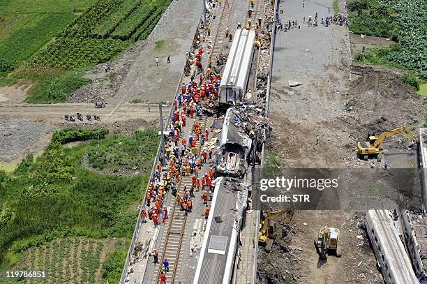 This aerial photo taken on July 24, 2011 shows rescue operations continuing on the wreckages of two high-speed trains that collided the night before...