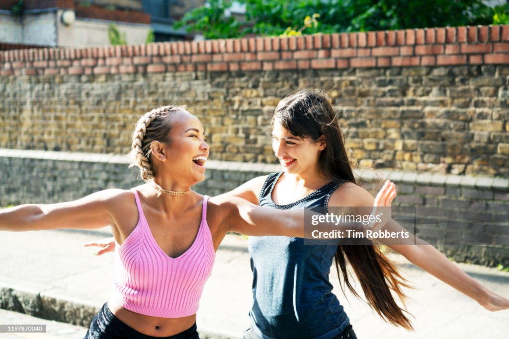 Two happy women messing about