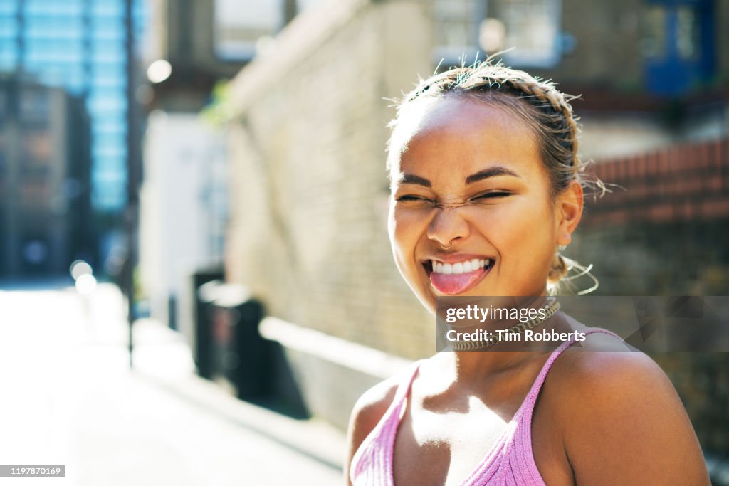 Woman sticking tongue out with smile