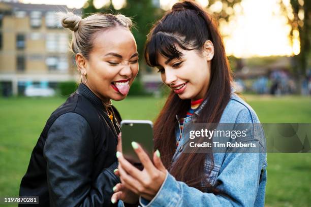 friends taking selfie, sticking tongue out - generazione y foto e immagini stock