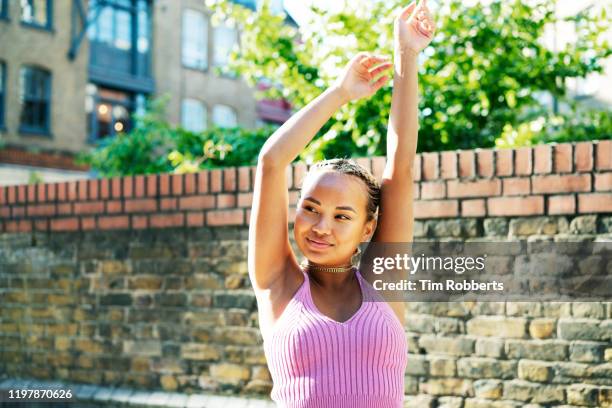 woman with arms in up - young women dancing stock pictures, royalty-free photos & images