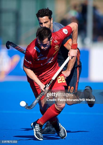 Marc Miralles of Spain competes for the ball with Valentin Verga of Netherlands during the FIH Pro League match between Spain and Netherlands at...