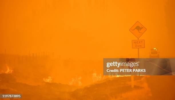 Bushfires burn near the town of Bumbalong south of Canberra on February 1, 2020. - Authorities in Canberra on January 31, 2020 declared the first...