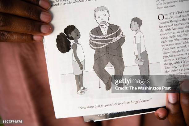 Elizabeth Montague is a young black cartoonist with work appearing in the New Yorker and the Washington City Paper. She holds a cartoon that appeared...