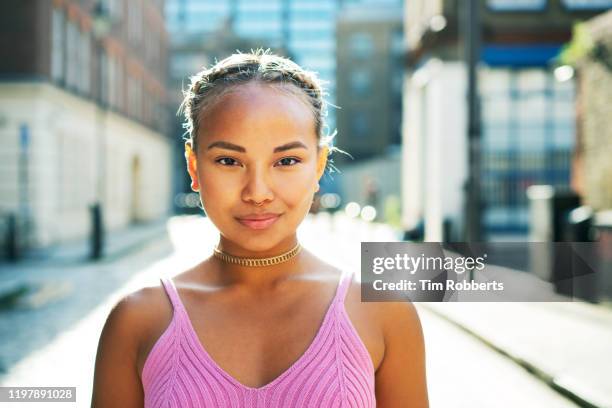 portrait of woman looking at camera - street fashion asian stock pictures, royalty-free photos & images