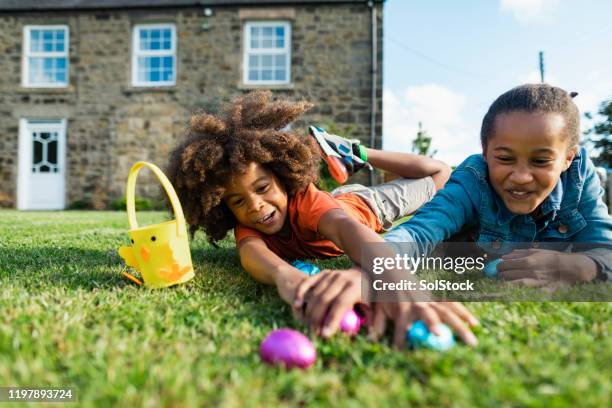 easter with my sister! - easter egg hunt outside stock pictures, royalty-free photos & images