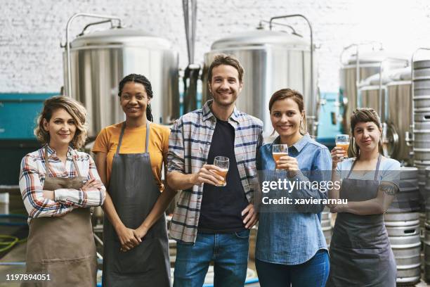 portrait of buenos aires craft beer brewery coworkers - microbrewery stock pictures, royalty-free photos & images