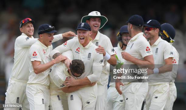 England bowler Joe Denly is congratulated by team mates left to right Joe Root, Sam Curran, Ben Stokes, Stuart Broad and James Anderson after taking...